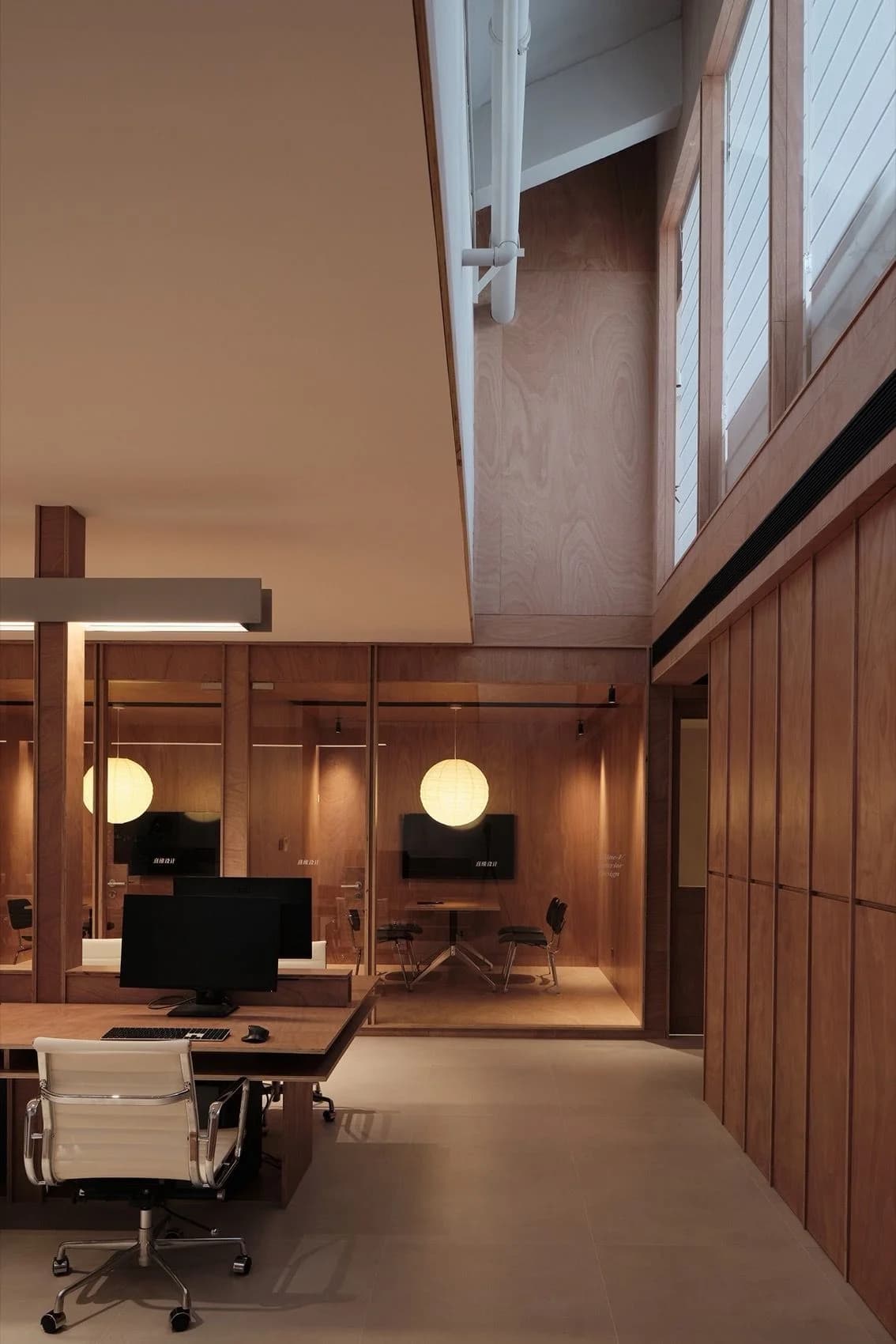 Warm wood meeting room with pendant lights