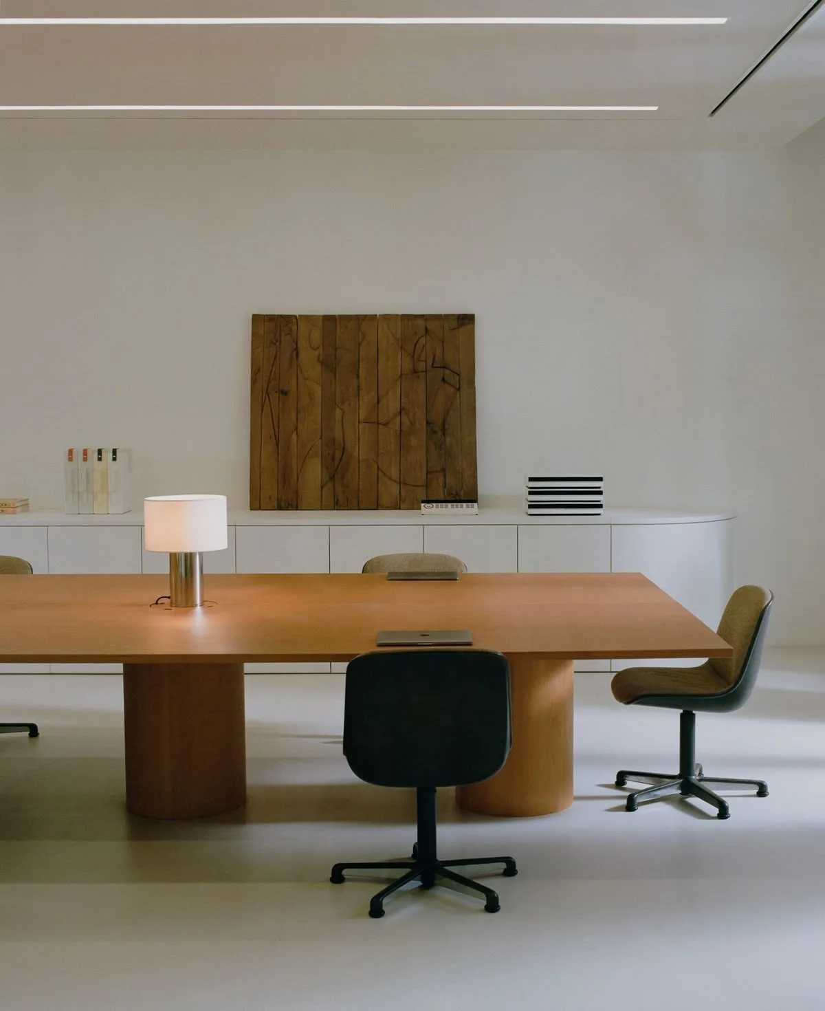 Modern minimalist meeting room with wood table