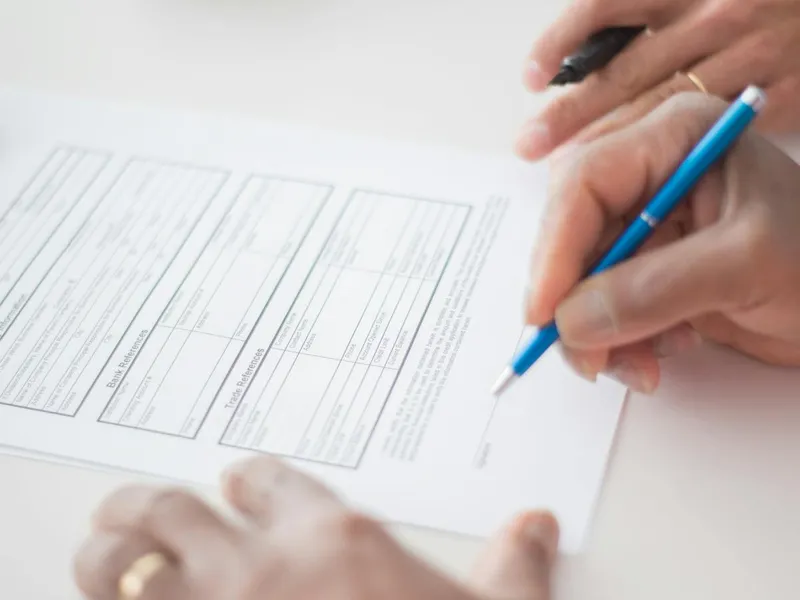 Signing a serviced-office agreement at a desk