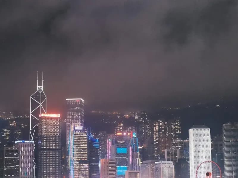 Central skyline towers over Victoria Harbour at dusk